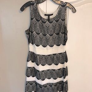 Black and white BCBG MaxAzria dress with scalloped lace detail. No defects.
